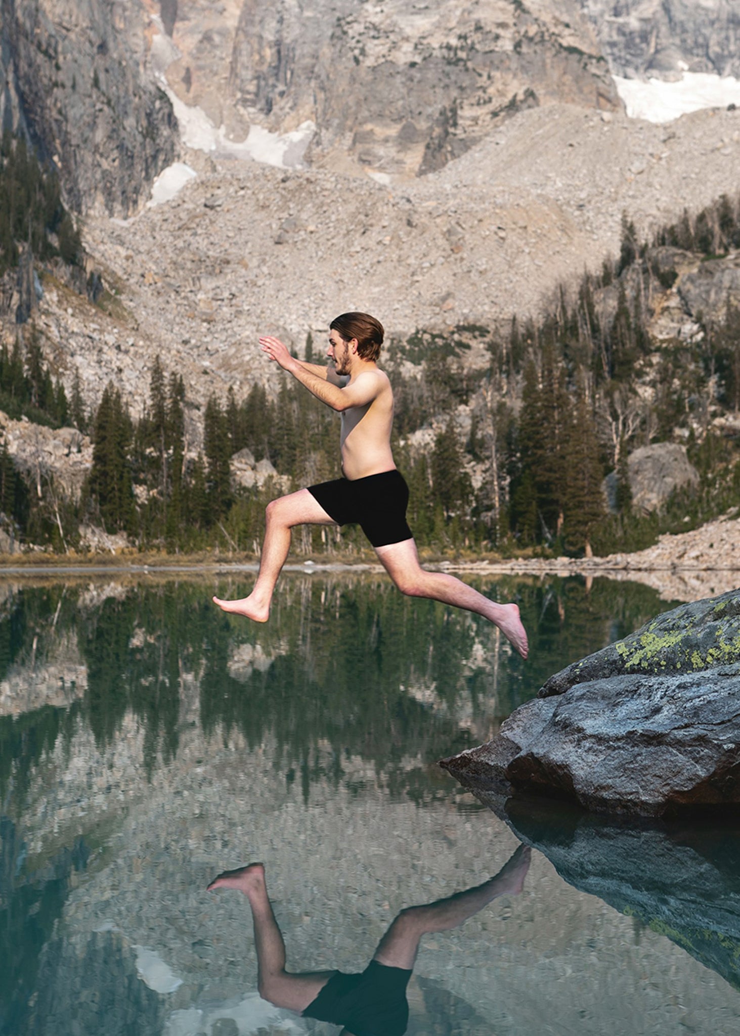 A man jumping into a lake